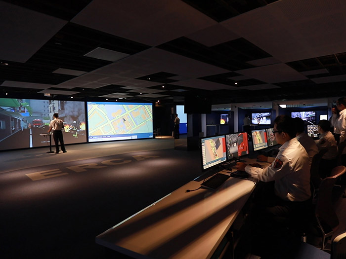 Incident Commander exploring the scene with Exercise Control executing the commands