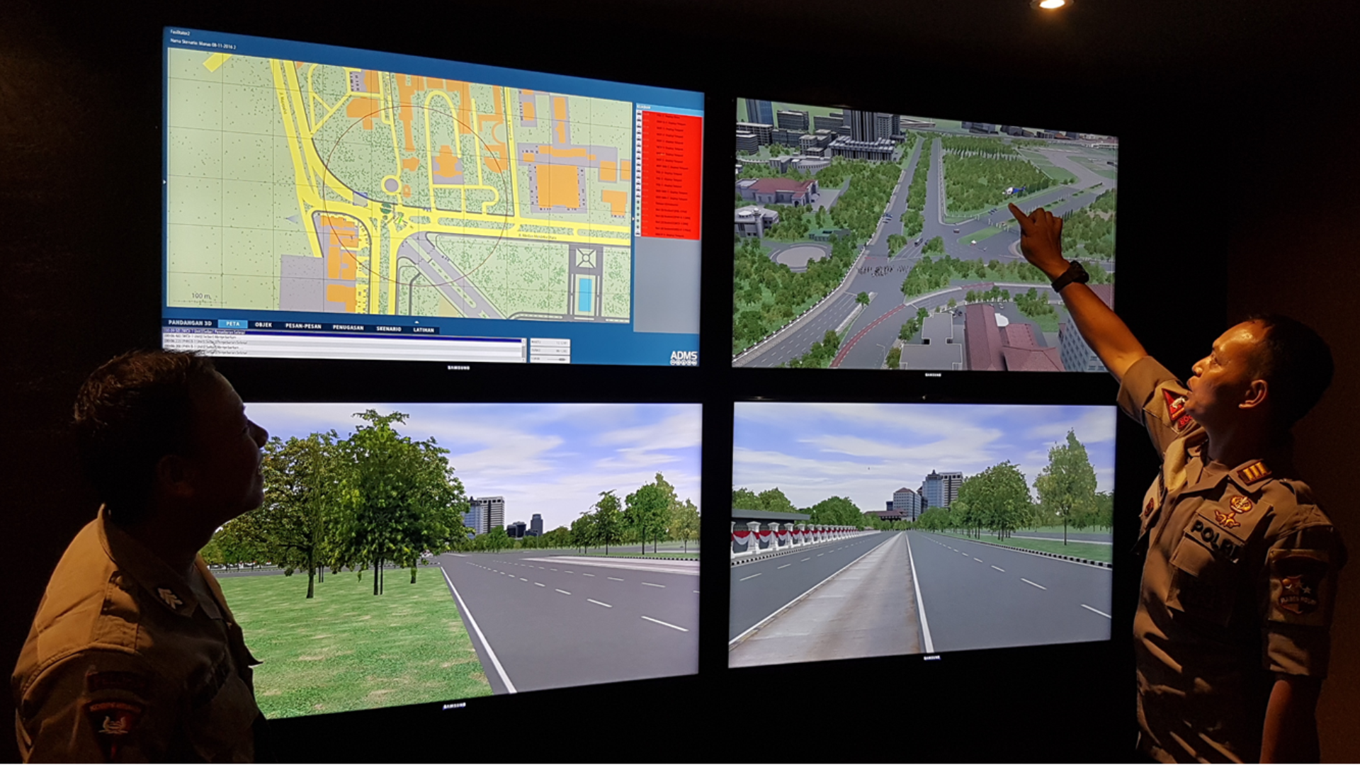 Police Commander explaining his strategy in front of four displays with live CCTV footage of the crowd control exercise.